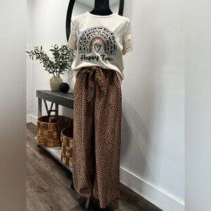 Happy Time Graphic Tee and Leopard Print Pants. Outfit is sold together.